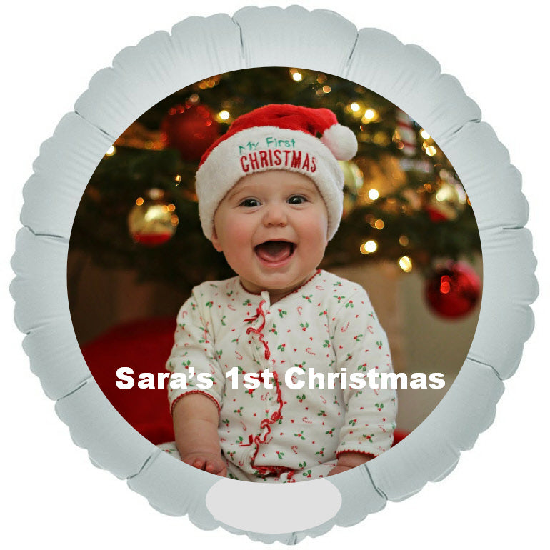 Smiling baby printed on balloon at Christmas.