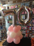 Silver number 70 balloon on top of pink and white balloons.