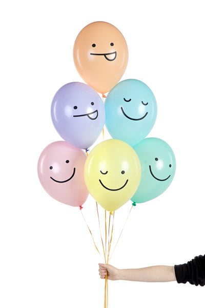 Bunch of balloons with funny face print.