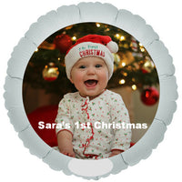 Smiling baby printed on balloon at Christmas.