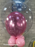 Pink communion bubble balloon.