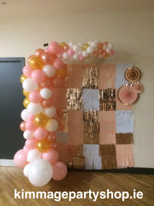 Pink, white and gold coloured organic style balloon arch.