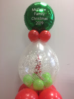 Toy elf in clear balloon with personalised balloon on top.