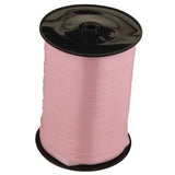 Baby pink roll of ribbon. 