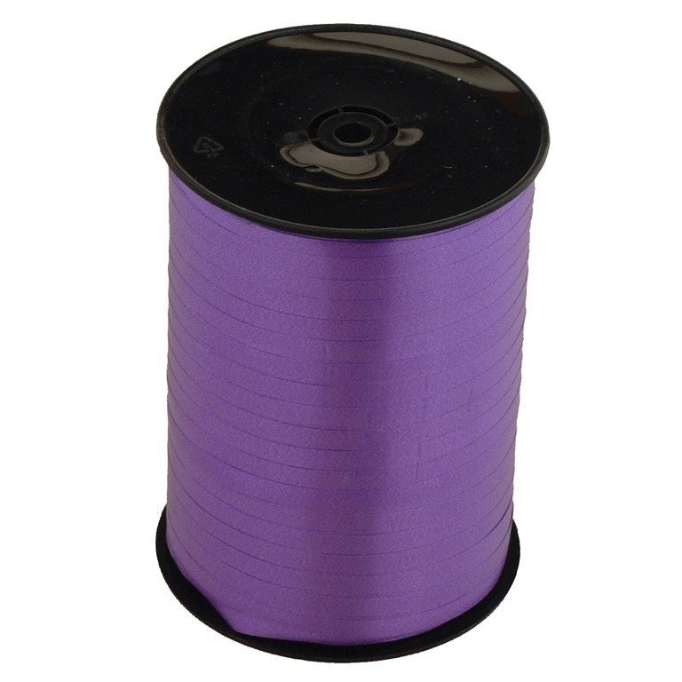 Roll of purple ribbon.