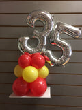 Silver number 35 balloon on top of red and yellow balloons.